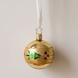 Gold mouth-blown glass ornament with a glittered red and green holly wreath, by Inge-Glas of Lauscha, Germany
