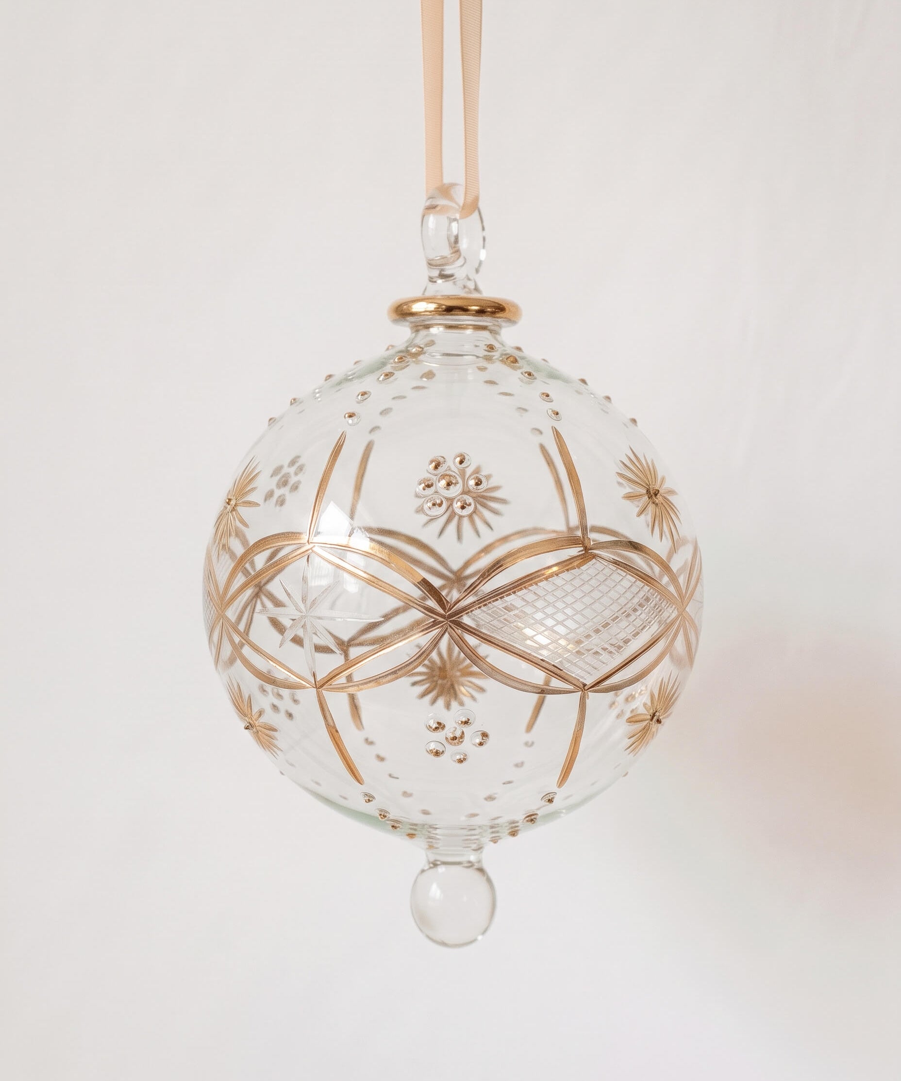 Large hand-blown clear glass bauble with hand-painted gold sunburst detail, made in Old Cairo, Egypt