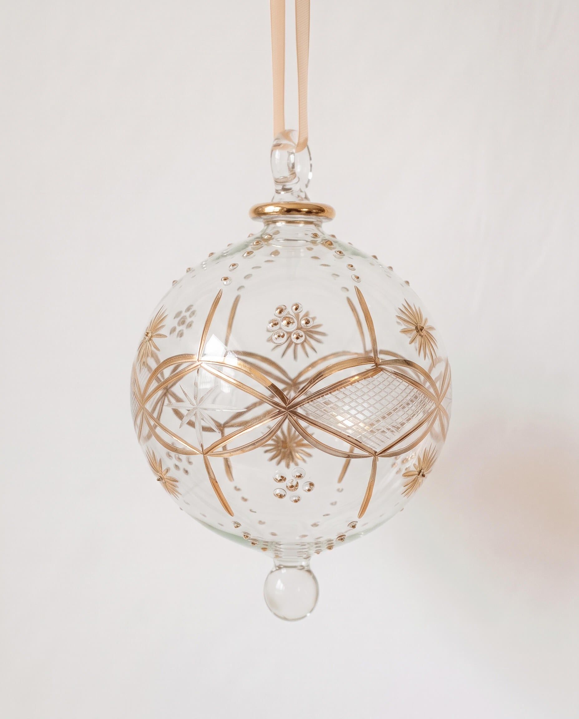 Large hand-blown clear glass bauble with hand-painted gold sunburst detail, made in Old Cairo, Egypt