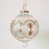 Large hand-blown green glass bauble with a gold checkered pattern, made in Old Cairo, Egypt