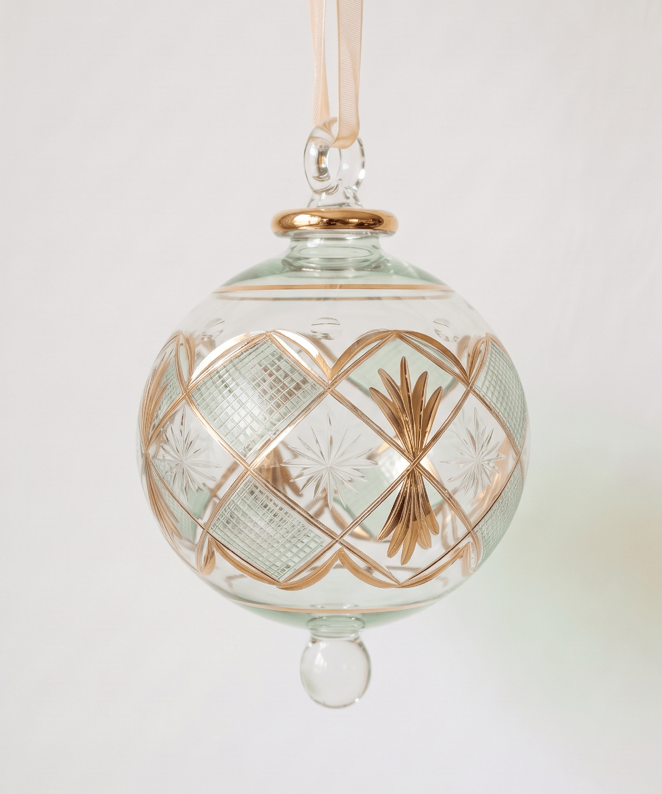 Large hand-blown green glass bauble with a gold checkered pattern, made in Old Cairo, Egypt