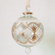 Large hand-blown green glass bauble with a gold checkered pattern, made in Old Cairo, Egypt