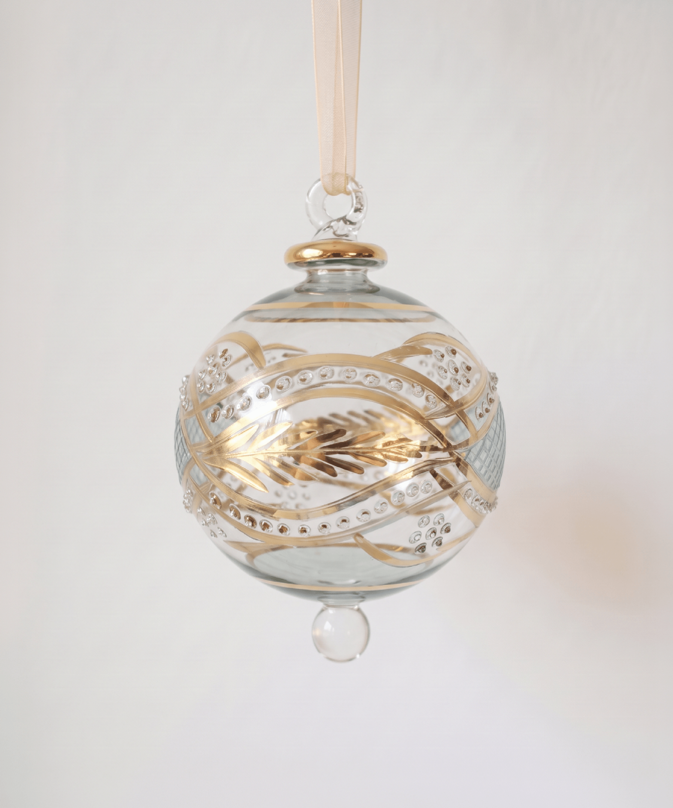 Large hand-blown green glass bauble painted with gold garland swags, made in Old Cairo, Egypt