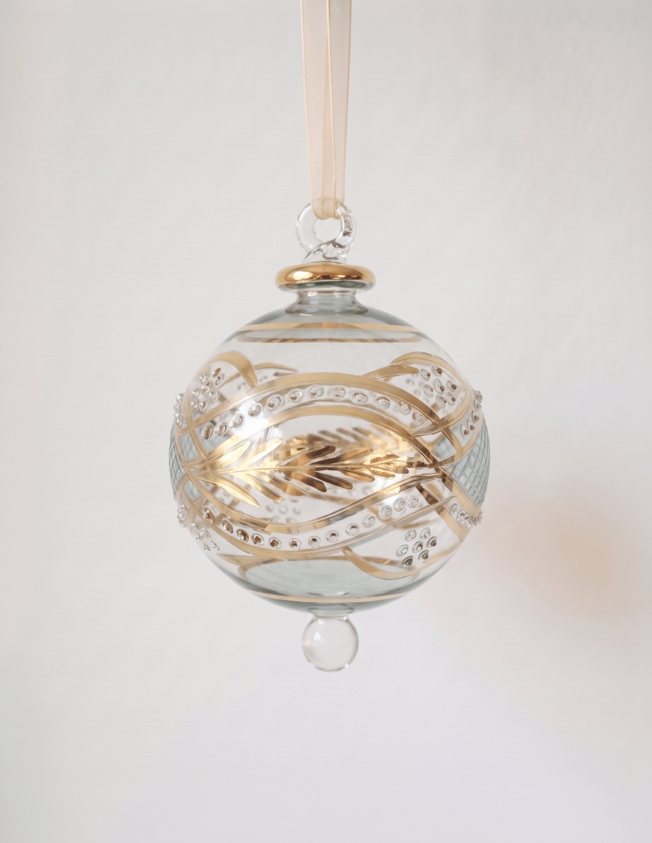 Large hand-blown green glass bauble painted with gold garland swags, made in Old Cairo, Egypt