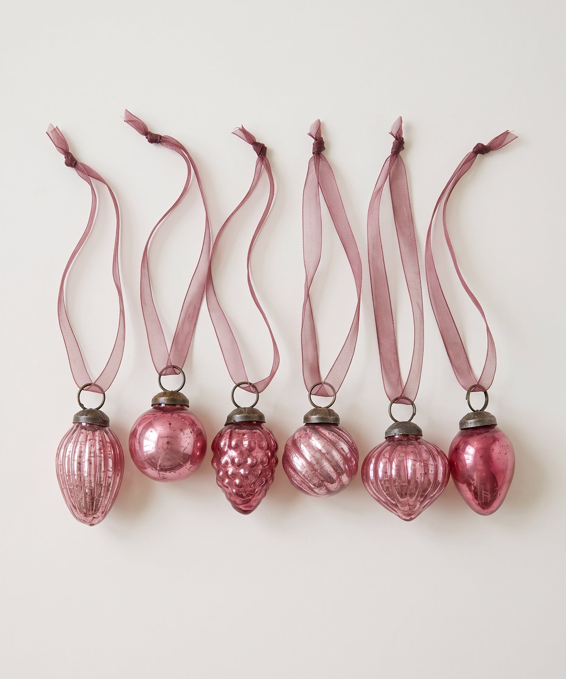 Set of six mauve crackle glass Christmas baubles with bronze caps and ribbon hangers, made in India