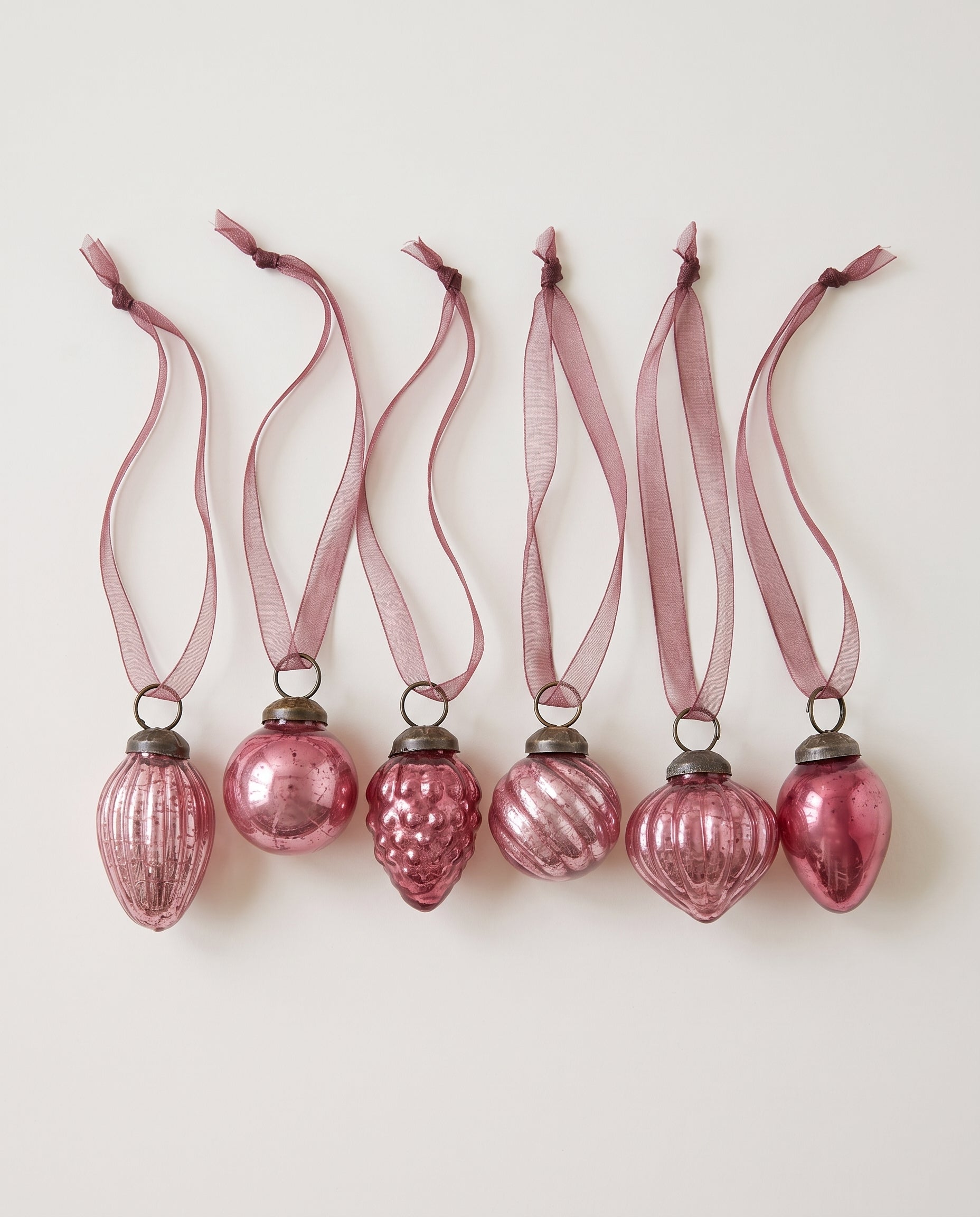 Set of six mauve crackle glass Christmas baubles with bronze caps and ribbon hangers, made in India