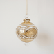 Miniature pale yellow hand-blown glass bauble with swirling gold garland pattern, made in Old Cairo, Egypt