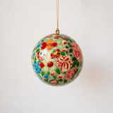 Papier-mache Christmas ornament hand-painted in Kashmir with intricate multicoloured florals