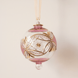 Hand-blown pink glass bauble circled with 14kt gold carousel bands, made in Old Cairo, Egypt