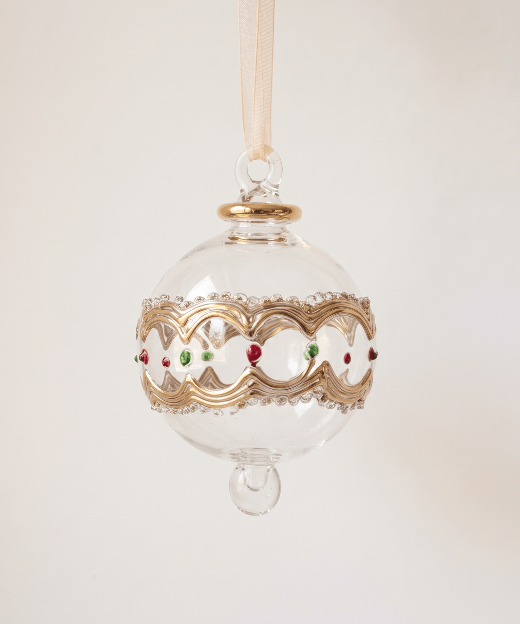 Hand-blown clear glass bauble painted red and green with gold scallops, made in Old Cairo, Egypt