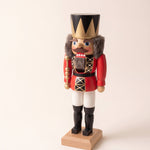 Red and gold hand-painted wooden nutcracker king with a crown, made in Seiffen, Germany