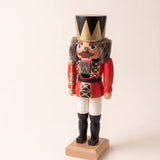 Red and gold hand-painted wooden nutcracker king with a crown, made in Seiffen, Germany