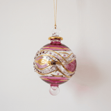 Small hand-blown ruby red glass bauble painted with gold garland swags, made in Old Cairo, Egypt