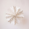 White paper cut snowflake ornament with a cotton hanger, inspired by Scandinavian paper craft