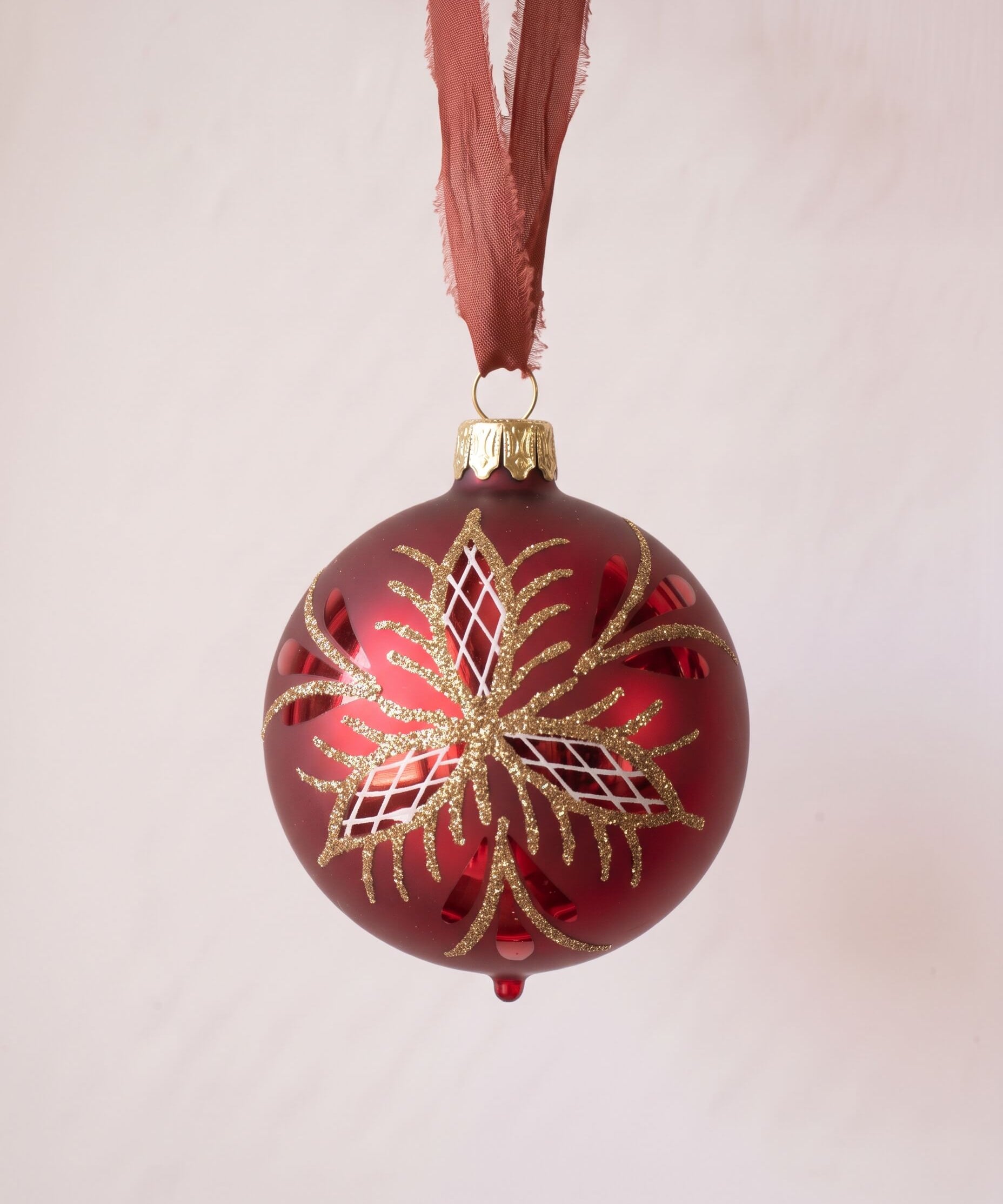 Red mouth-blown German glass bauble with glittered matte and shiny panels, another view