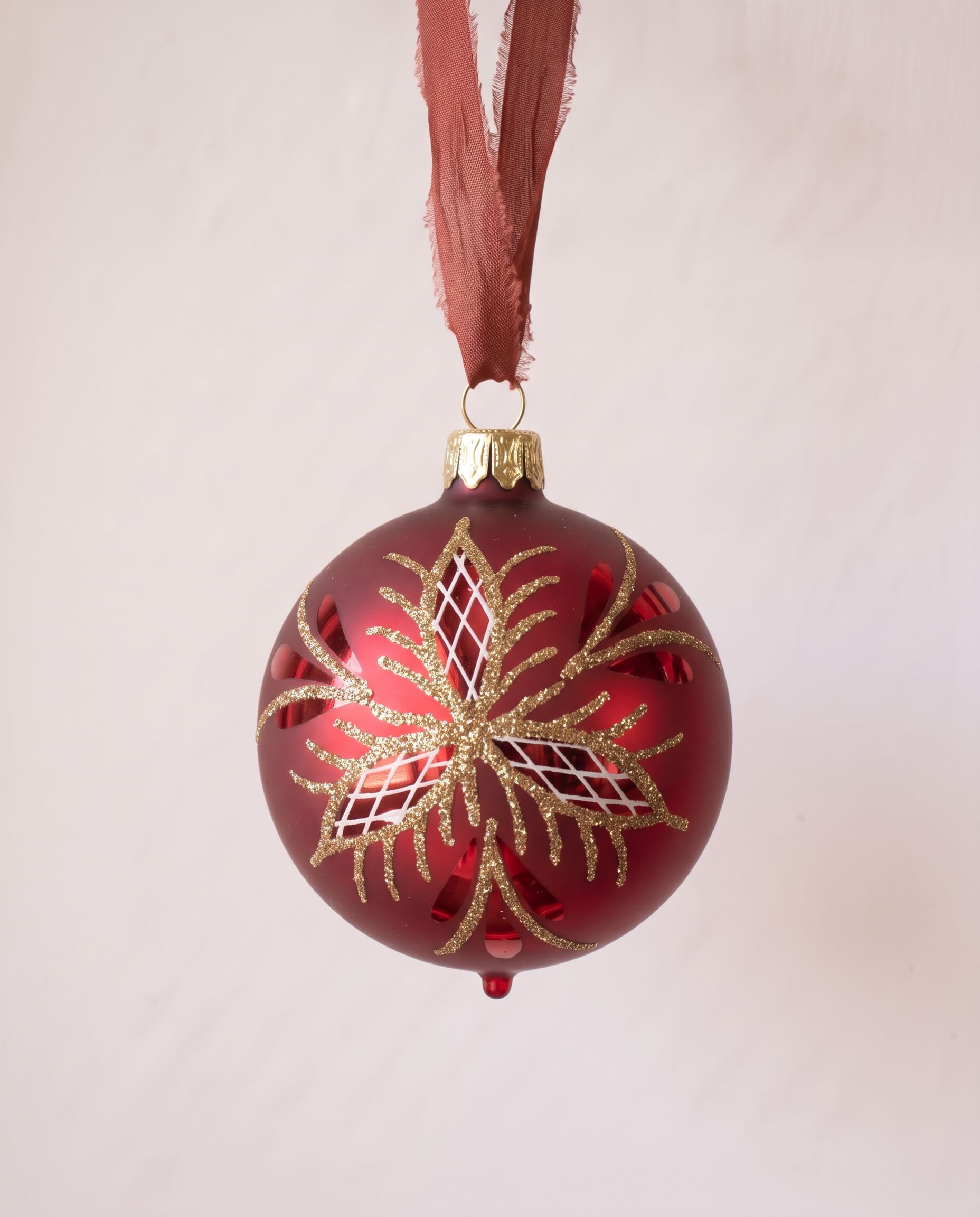 Red mouth-blown German glass bauble with glittered matte and shiny panels, another view