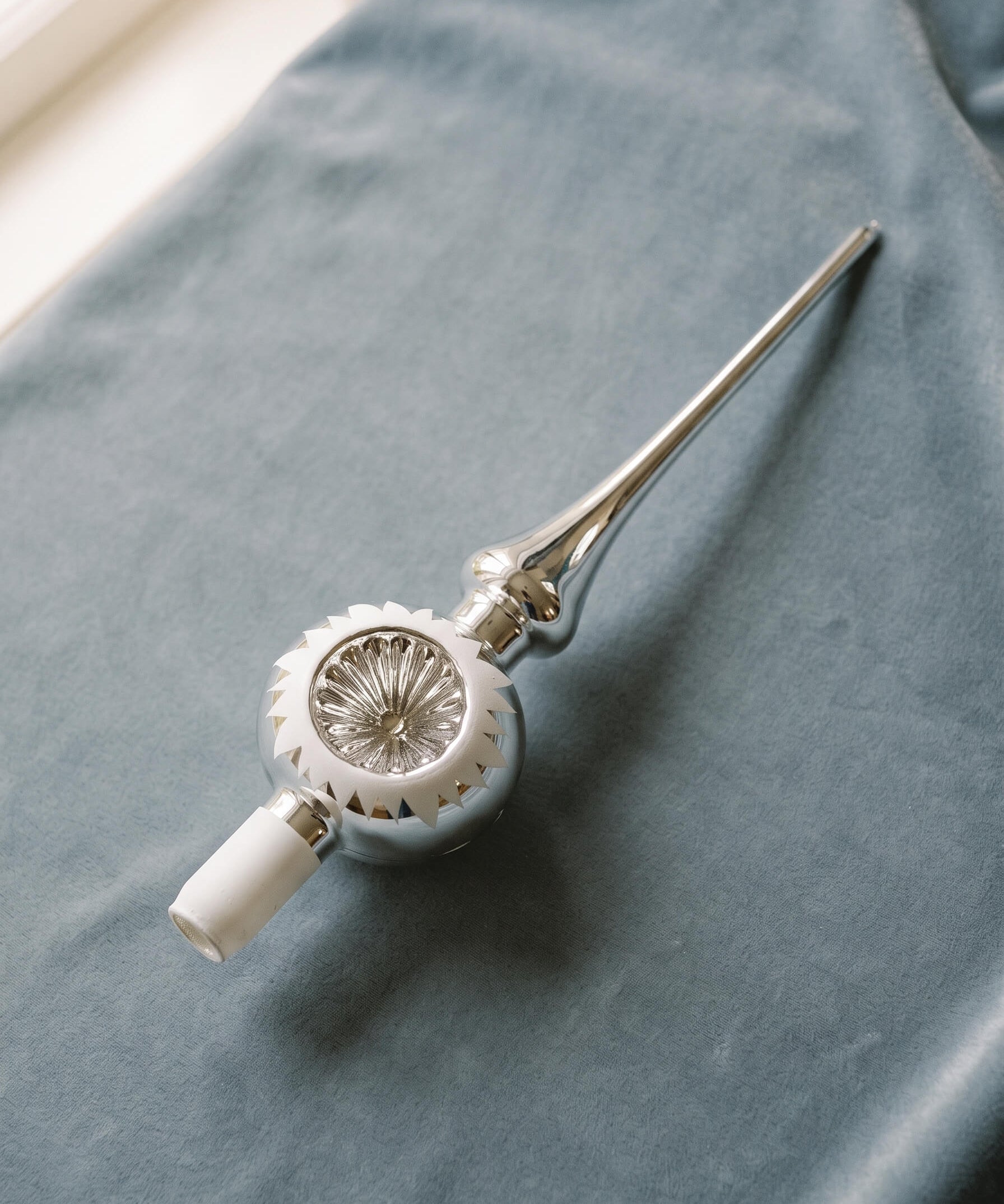 Silver mouth-blown glass tree topper with a reflector centre and white tip, by Inge-Glas of Lauscha, Germany