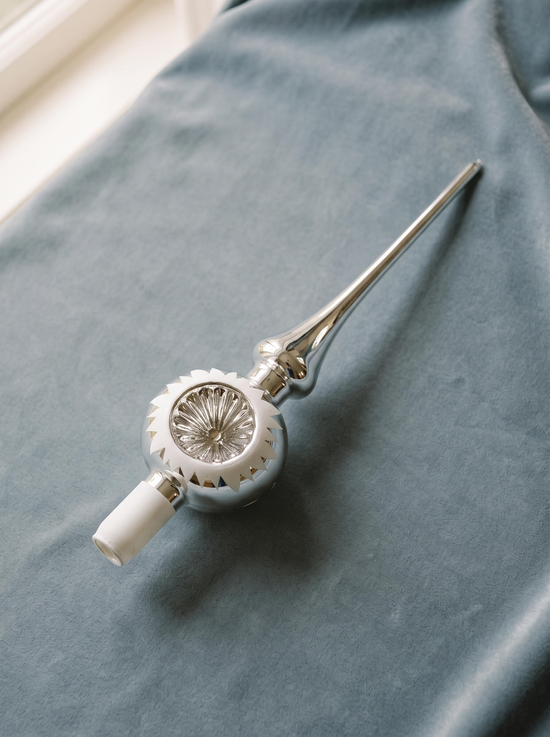 Silver mouth-blown glass tree topper with a reflector centre and white tip, by Inge-Glas of Lauscha, Germany
