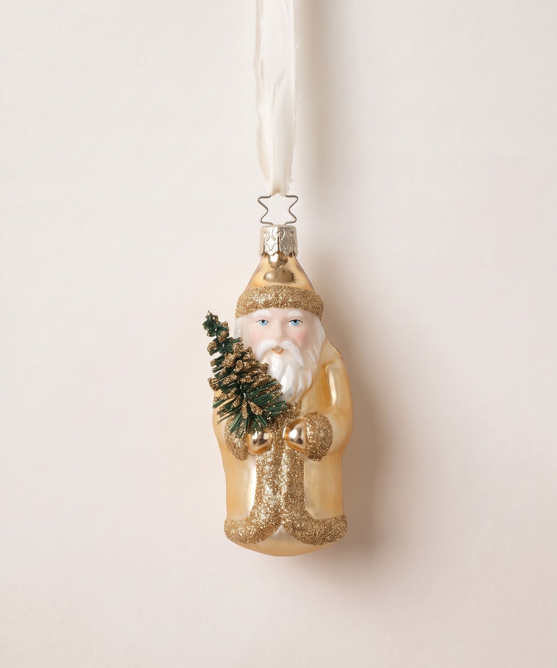 Gold mouth-blown glass St. Nicholas ornament holding a small evergreen, by Inge-Glas of Lauscha, Germany