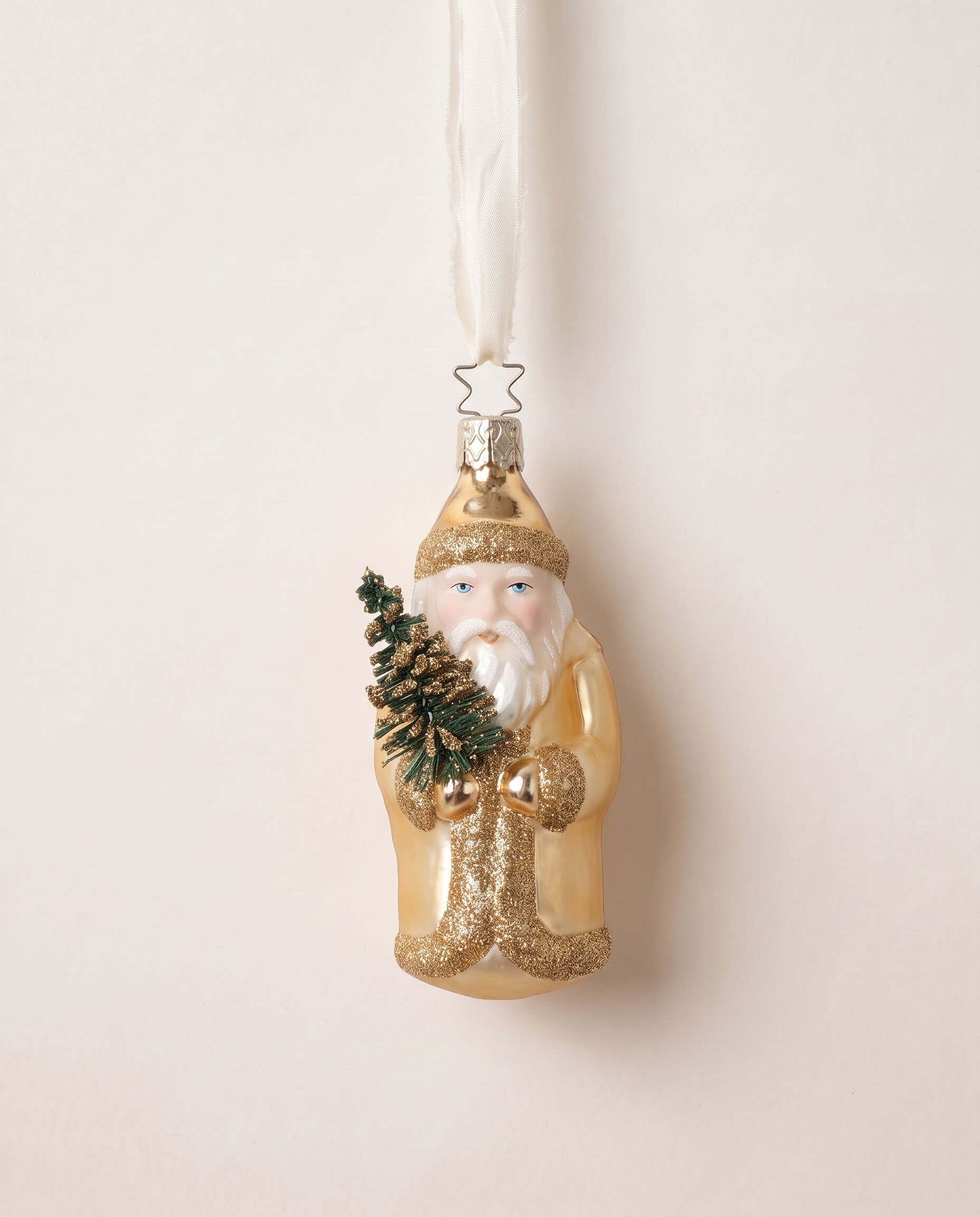 Gold mouth-blown glass St. Nicholas ornament holding a small evergreen, by Inge-Glas of Lauscha, Germany