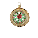 Gold glass reflector ornament with a red and green star centre and gold glitter swirls, another view