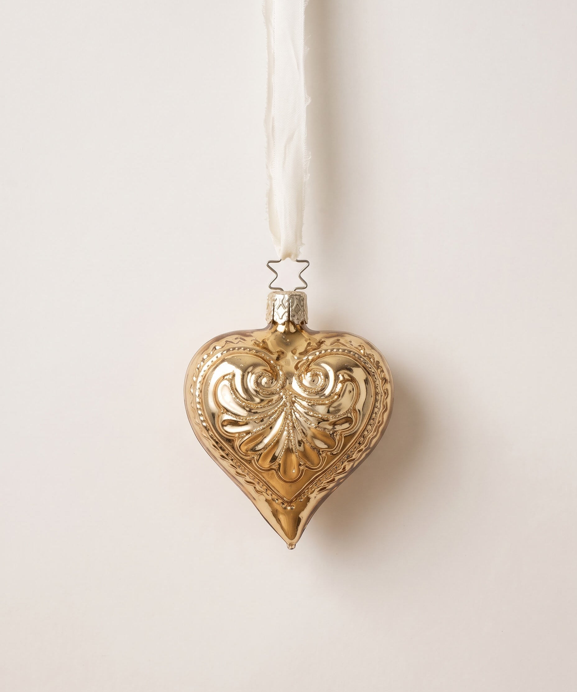 Antique gold mouth-blown glass heart ornament with a frosted glitter wash, by Inge-Glas of Lauscha, Germany