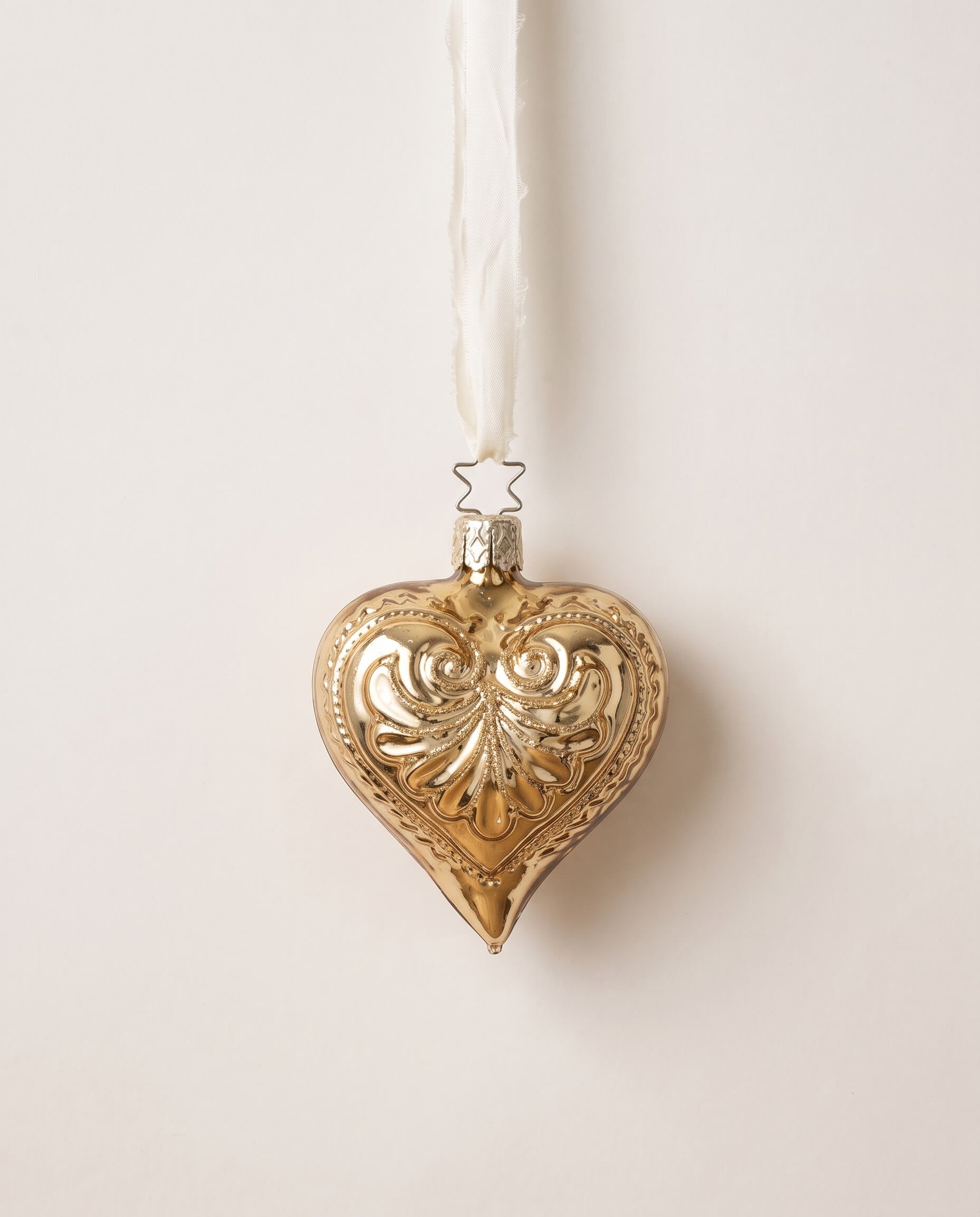 Antique gold mouth-blown glass heart ornament with a frosted glitter wash, by Inge-Glas of Lauscha, Germany