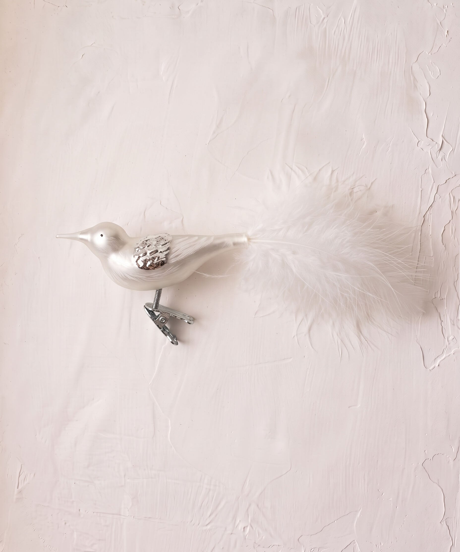 Matte off-white mouth-blown glass songbird ornament with a clip base, another view
