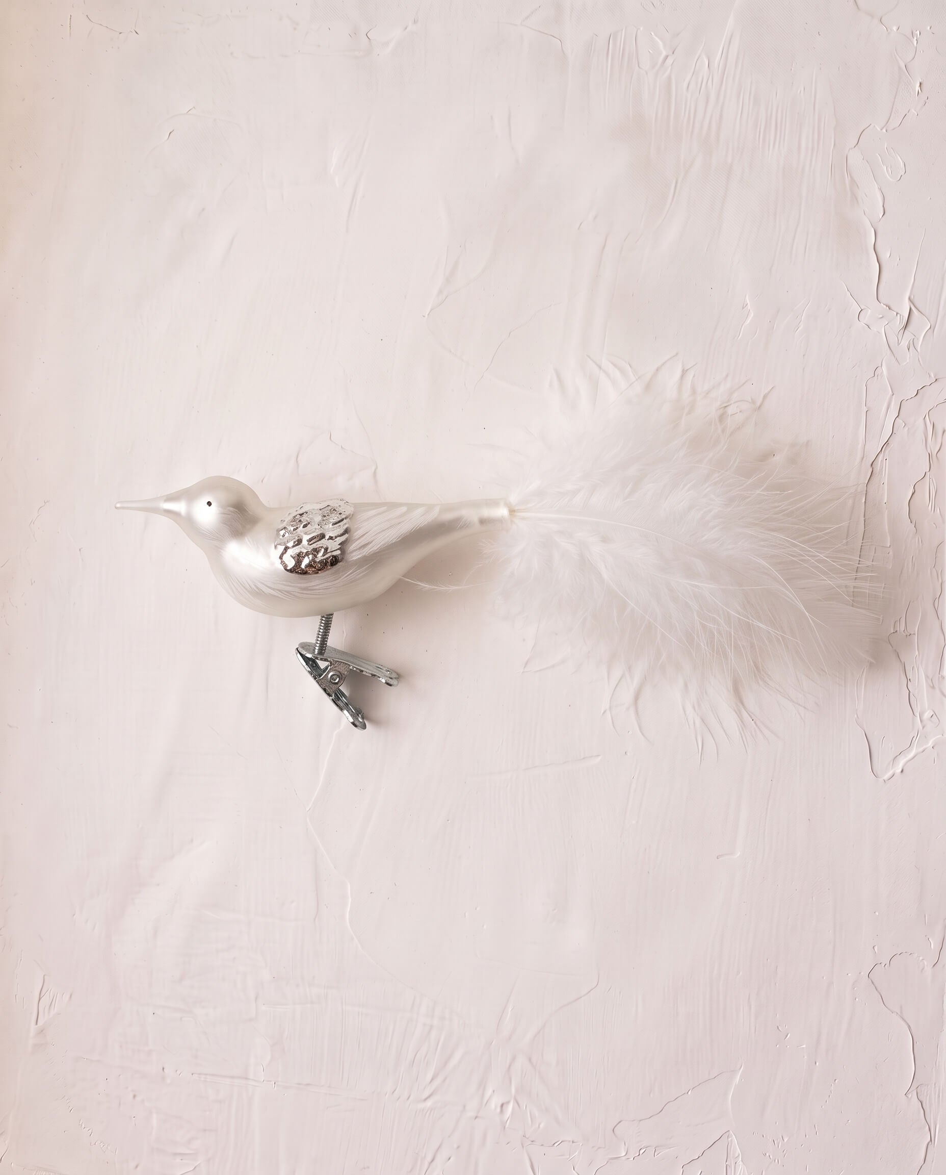 Matte off-white mouth-blown glass songbird ornament with a clip base, another view