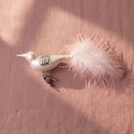 Matte off-white mouth-blown glass songbird ornament with a clip base, by Inge-Glas of Lauscha, Germany