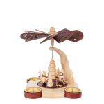 Wooden candle pyramid with hand-carved winter children scene, made in Seiffen, Germany.