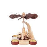 Wooden candle pyramid with hand-carved winter children scene, made in Seiffen, Germany.