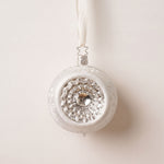 Matte white and silver glass reflector ornament with a reflective centre, mouth-blown by Inge-Glas of Germany