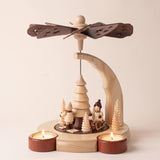 Hand-painted wooden candle pyramid with three children at play among trees, another view