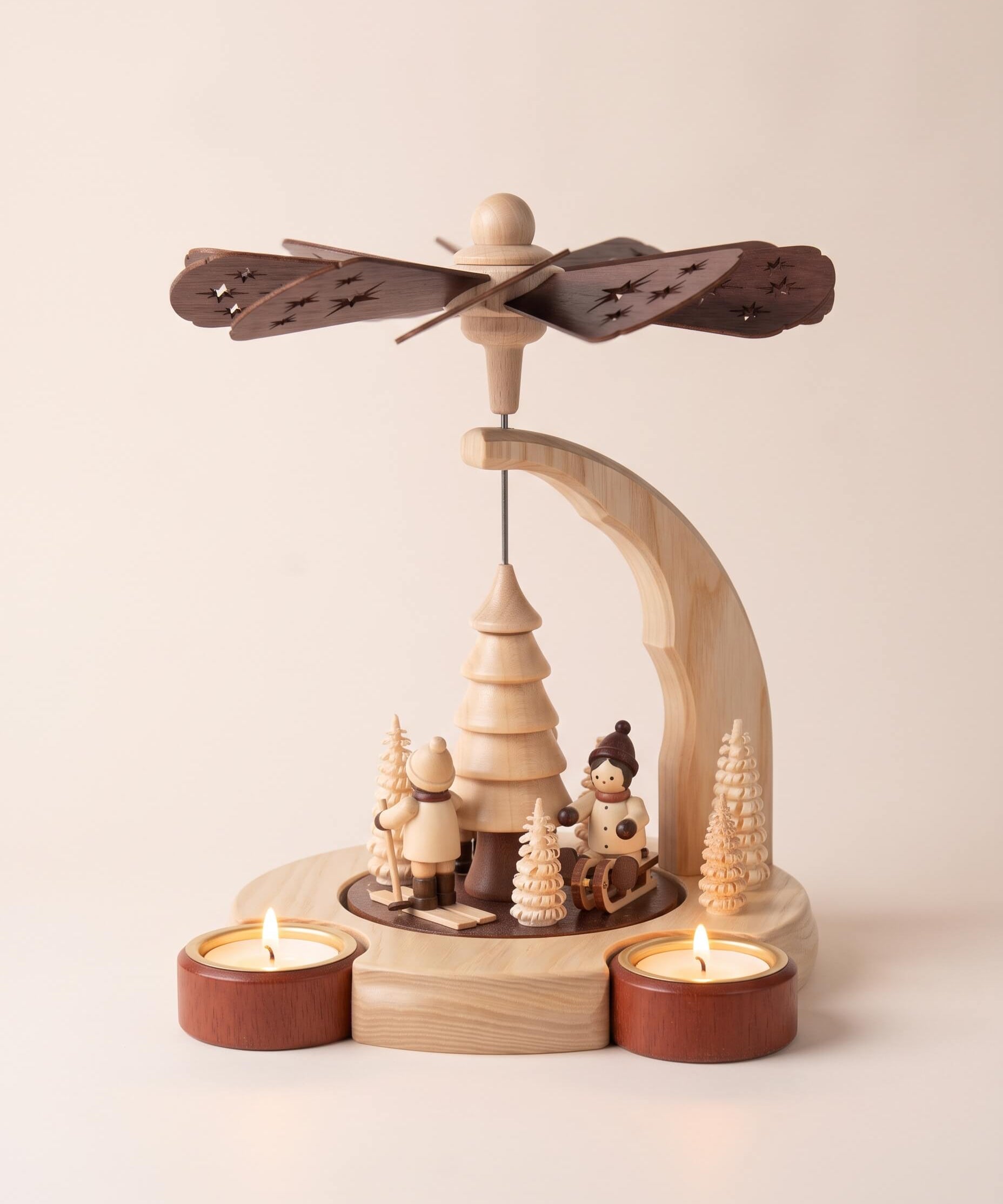 Hand-painted wooden candle pyramid with three children at play among trees, another view