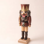Brown and gold hand-painted wooden nutcracker king with a crown, made in Seiffen, Germany