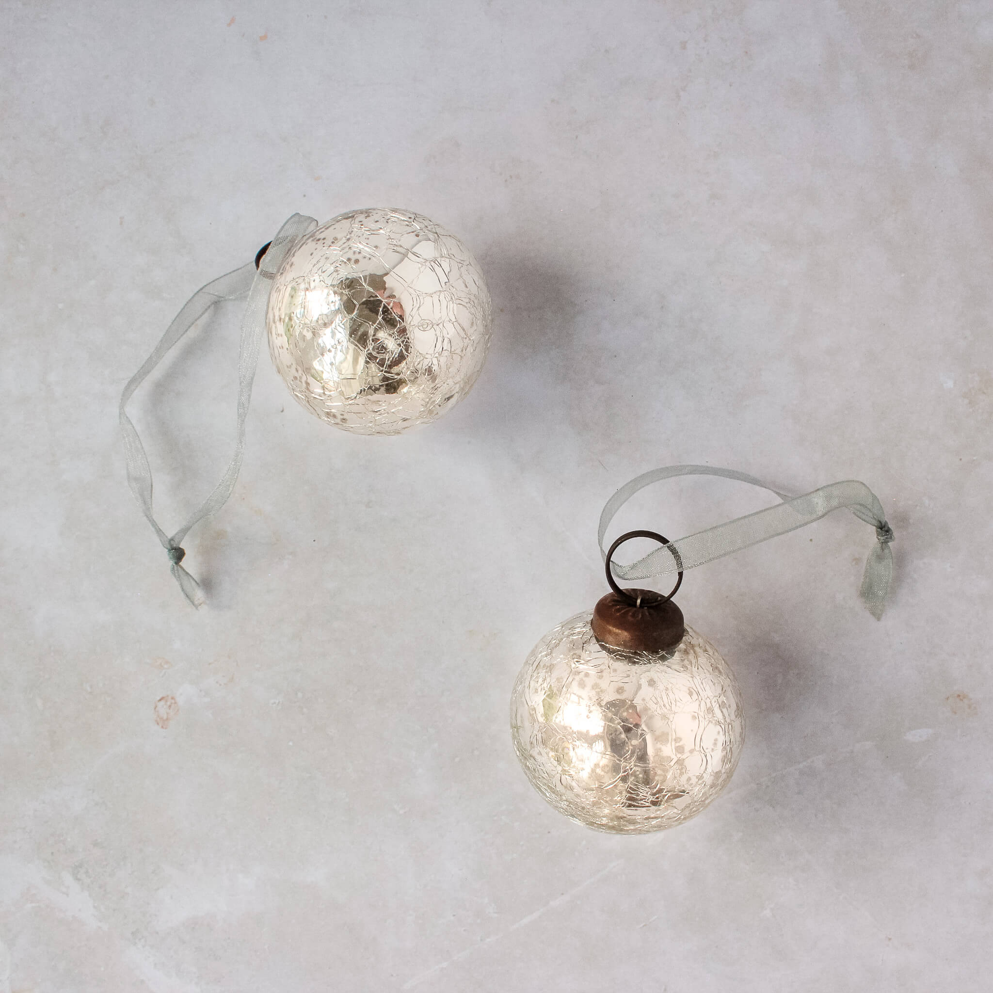 2 inch silver crackle glass Christmas bauble with a bronze cap and ribbon hanger, made in India