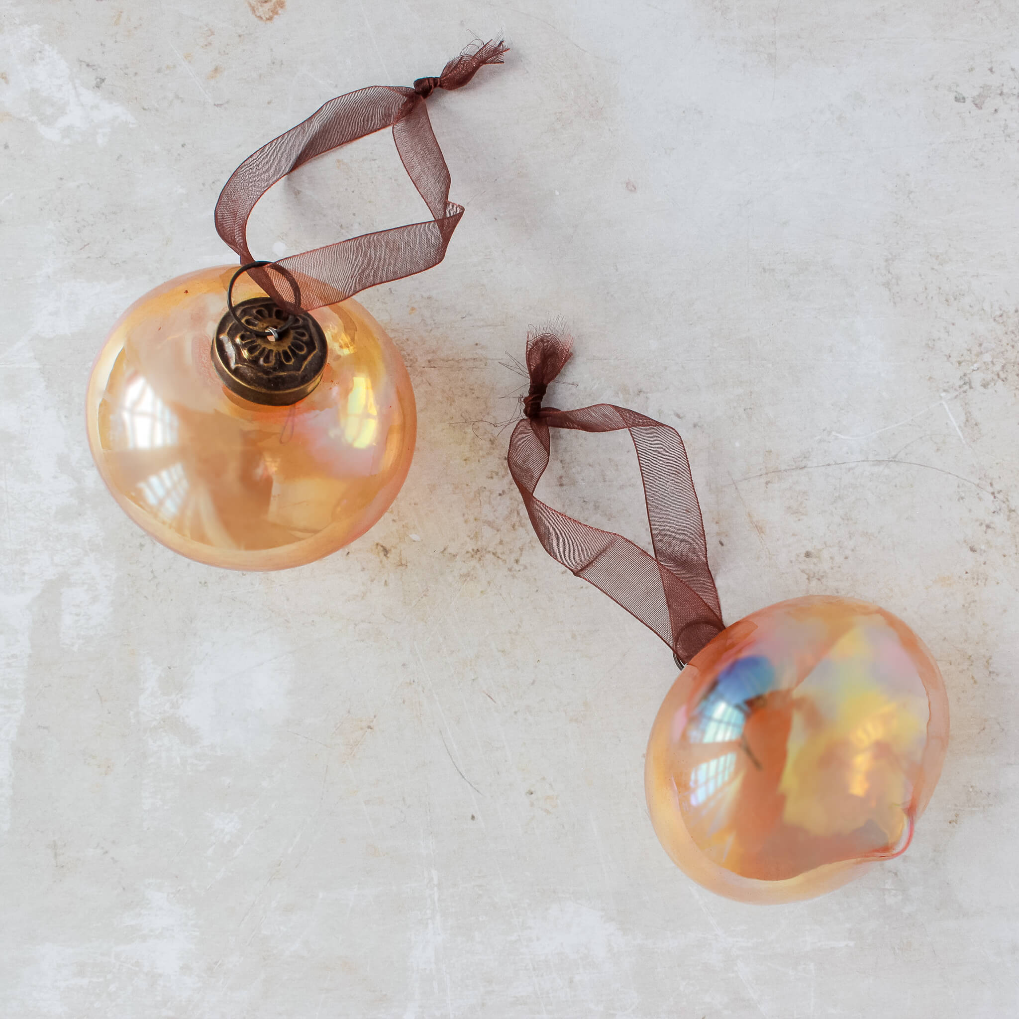 3 inch copper lustre pressed glass lantern ornament with a bronze cap and ribbon hanger, made in India