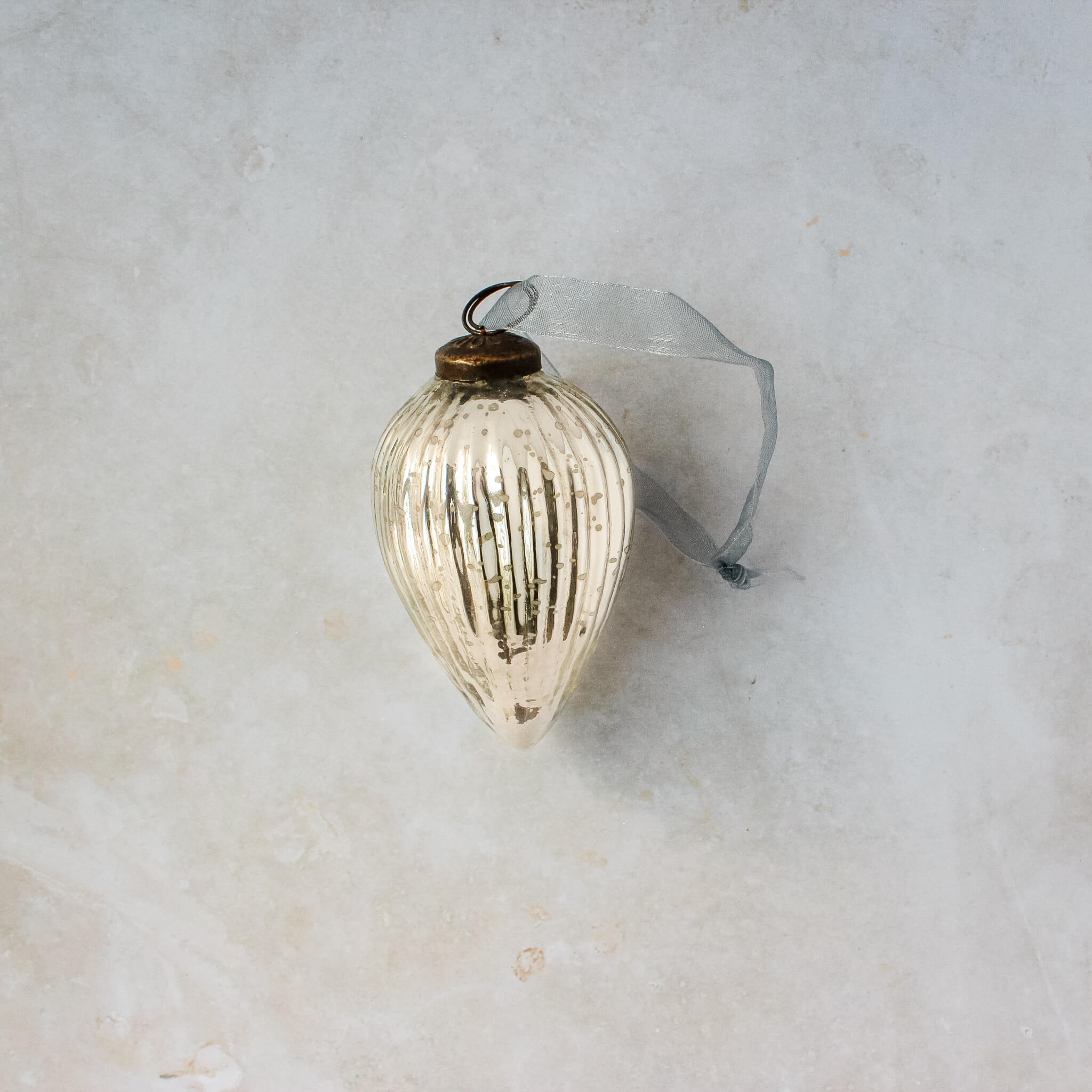 3 inch silver pressed glass pinecone ornament with a bronze cap and ribbon hanger, another view