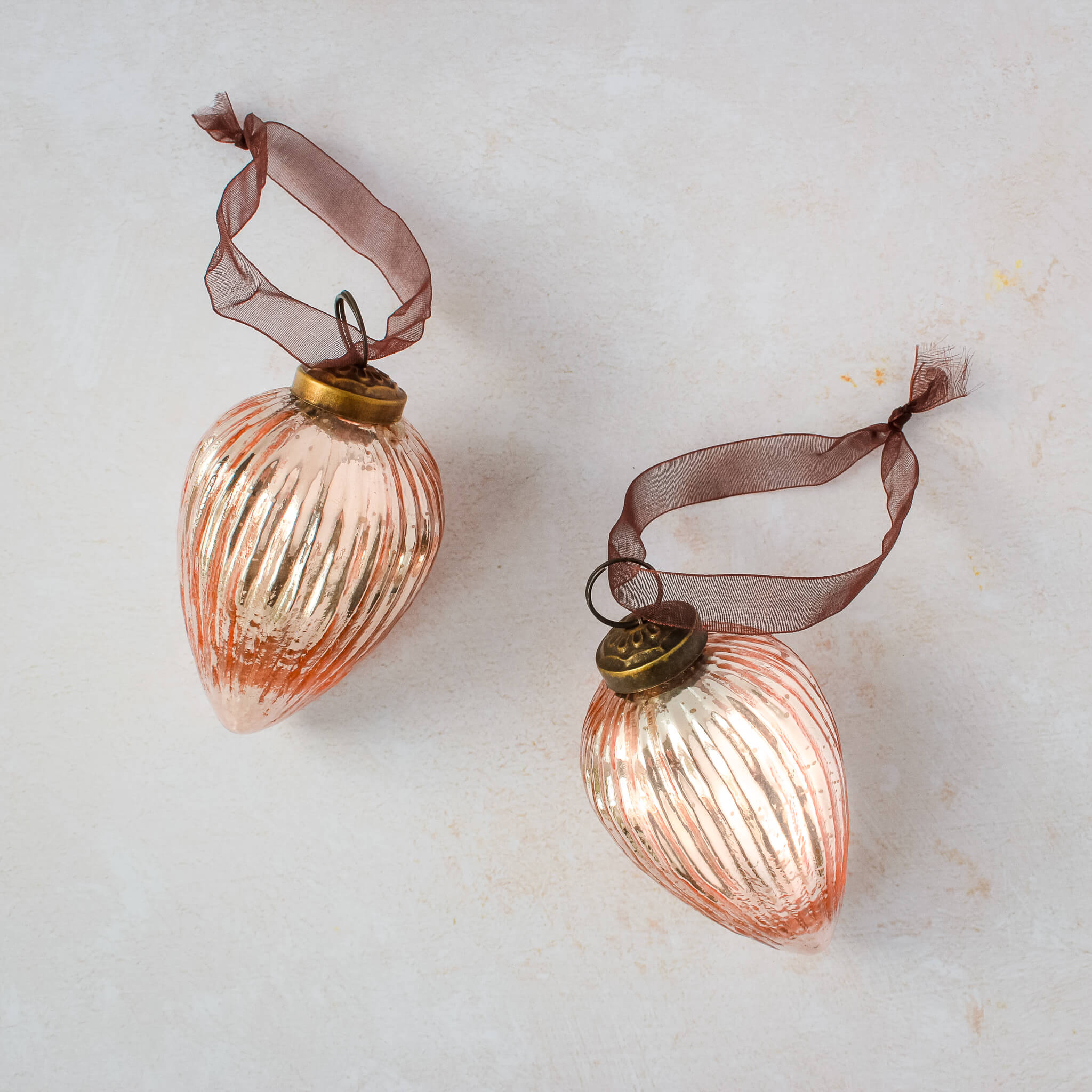 3 inch rose pressed glass pinecone ornament with a bronze cap and ribbon hanger, another view