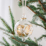 Hand-blown clear glass bauble painted with gold snowflakes, another view