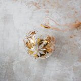 Hand-blown clear glass bauble painted with gold snowflakes, another view