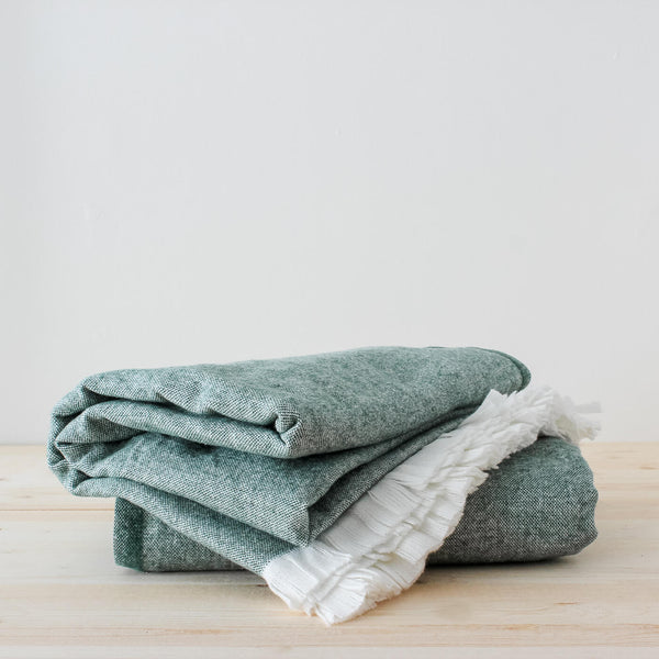 Bottle Green Recycled Cotton Eyelash Throw is made in Spain